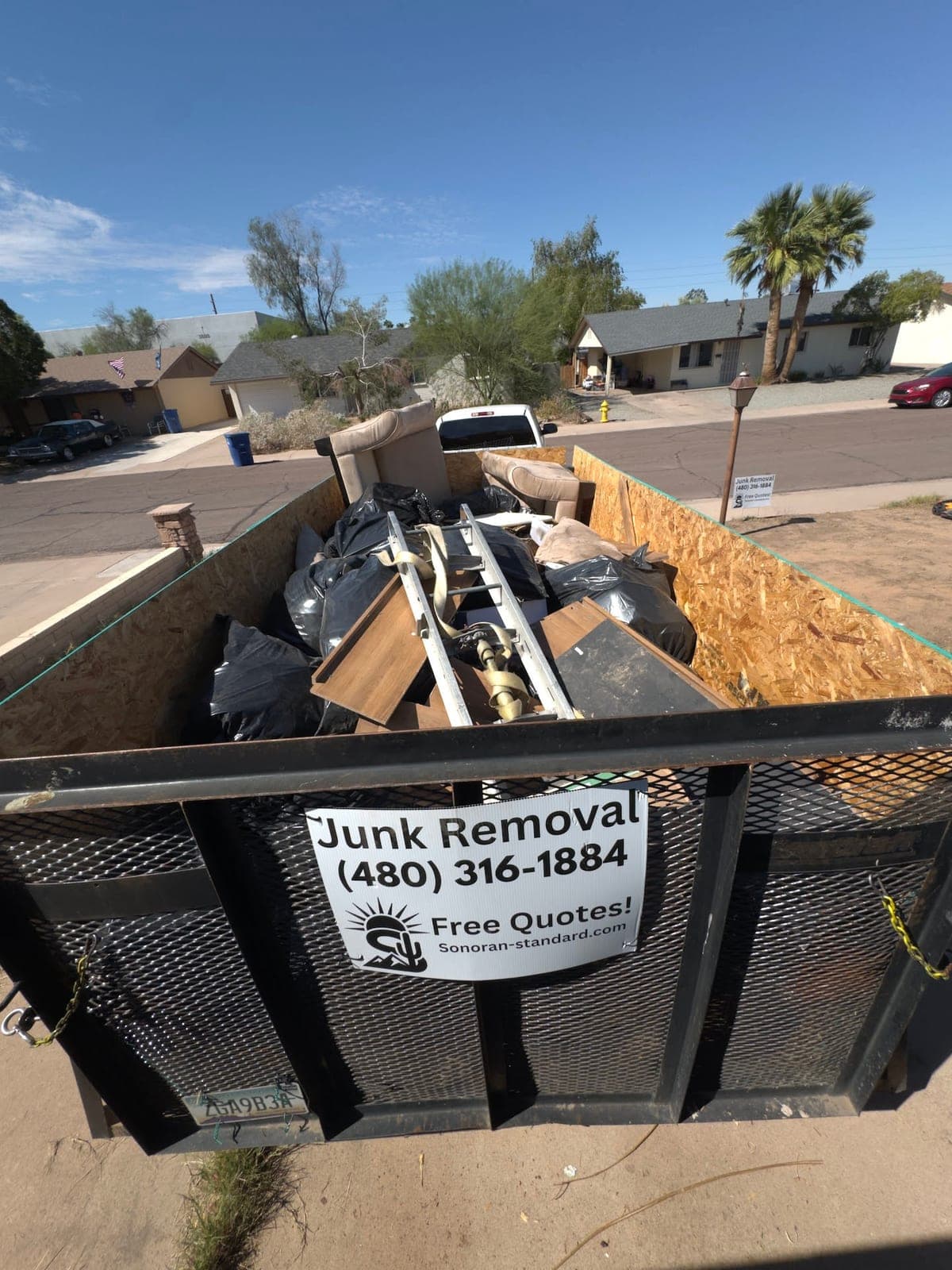 Trailer filled with a second load of bags and furniture