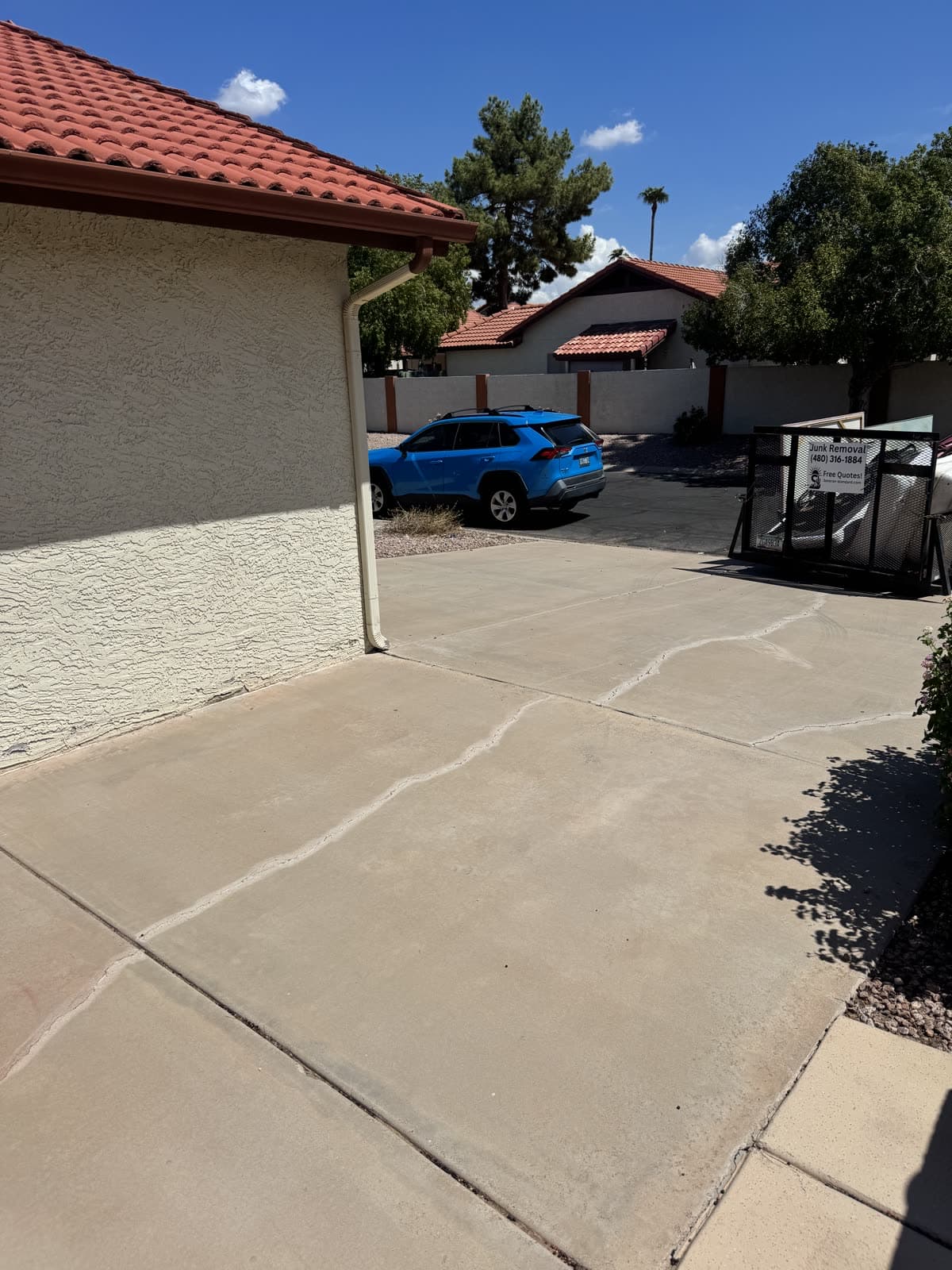 Cleared driveway seen from the street after a junk removal job
