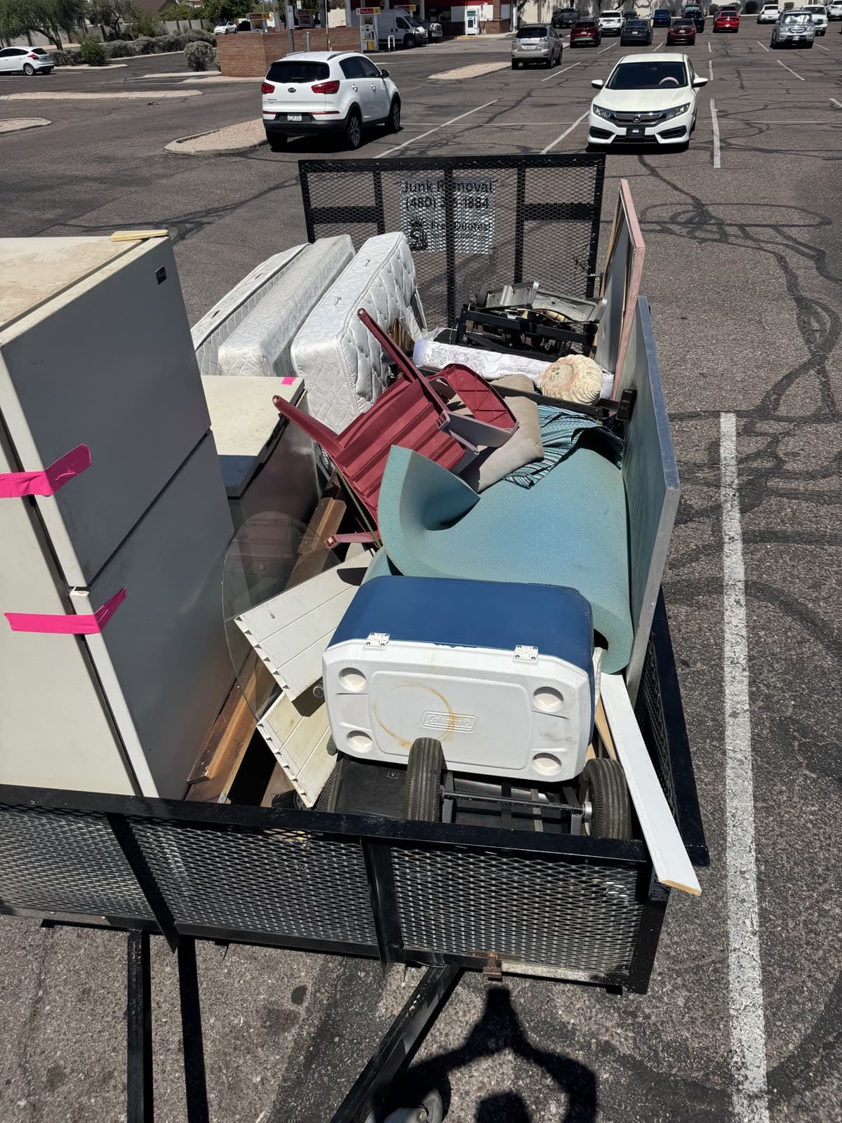 Refrigerator, mattress, cooler, and furniture strapped down on the Sonoran Standard trailer